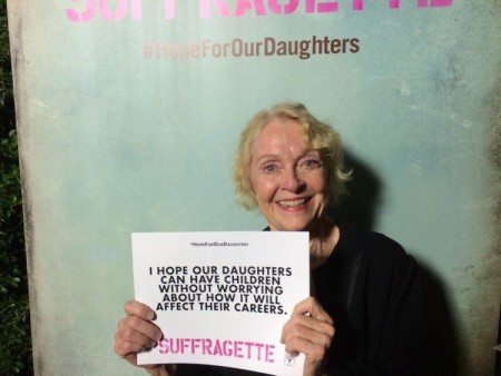 K Callan holding a card supporting the campaign to save daughters
